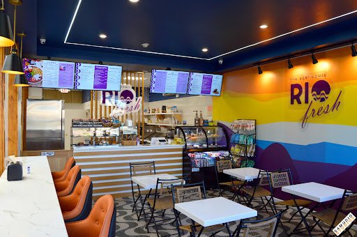 Authentic Rio Fresh açaí bowl topped with fresh strawberries, blueberries, and crunchy granola